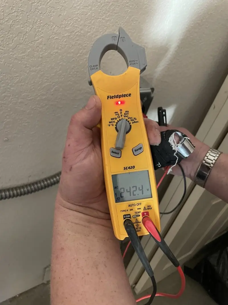 Voltage testing with clamp meter during Whole House Surge Protector in Hortonville